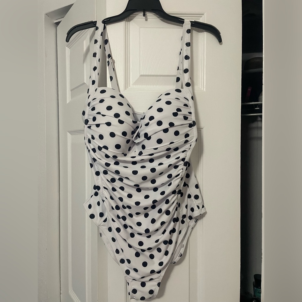 Black and white polka dot bathing suit.